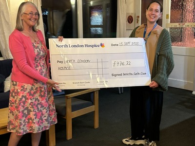 Max presenting the cheque to Rachel of the North London Hospice